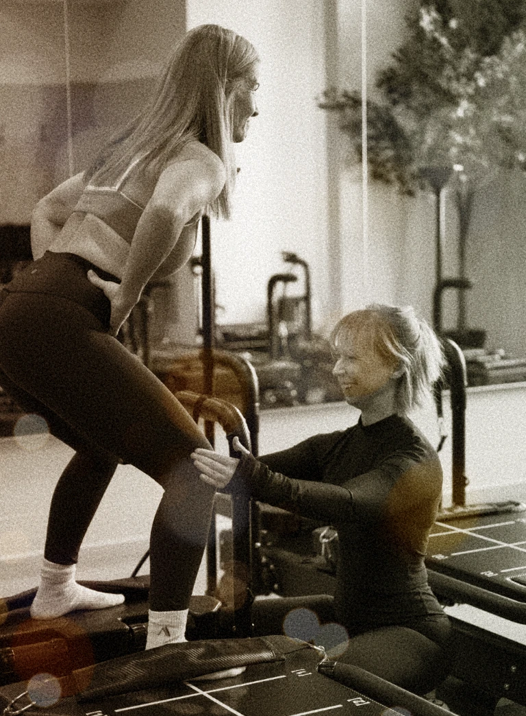 A woman using a Sculptformer machine in the Align Studio with an instructor